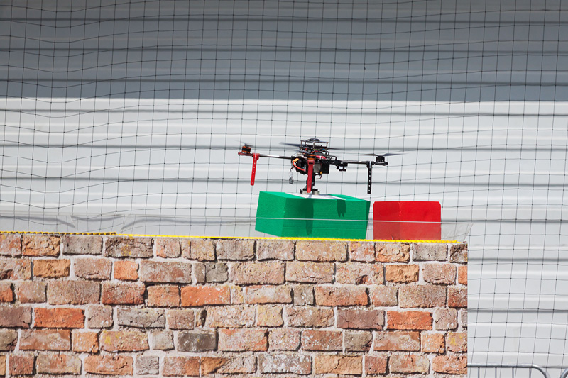Drone laying a wall